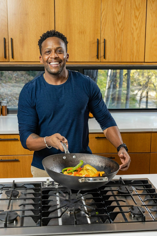 Man preparing healthy food, supporting sexual wellness through lifestyle